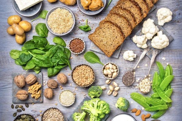 Vegan protein sources. Top view on a grey wooden background